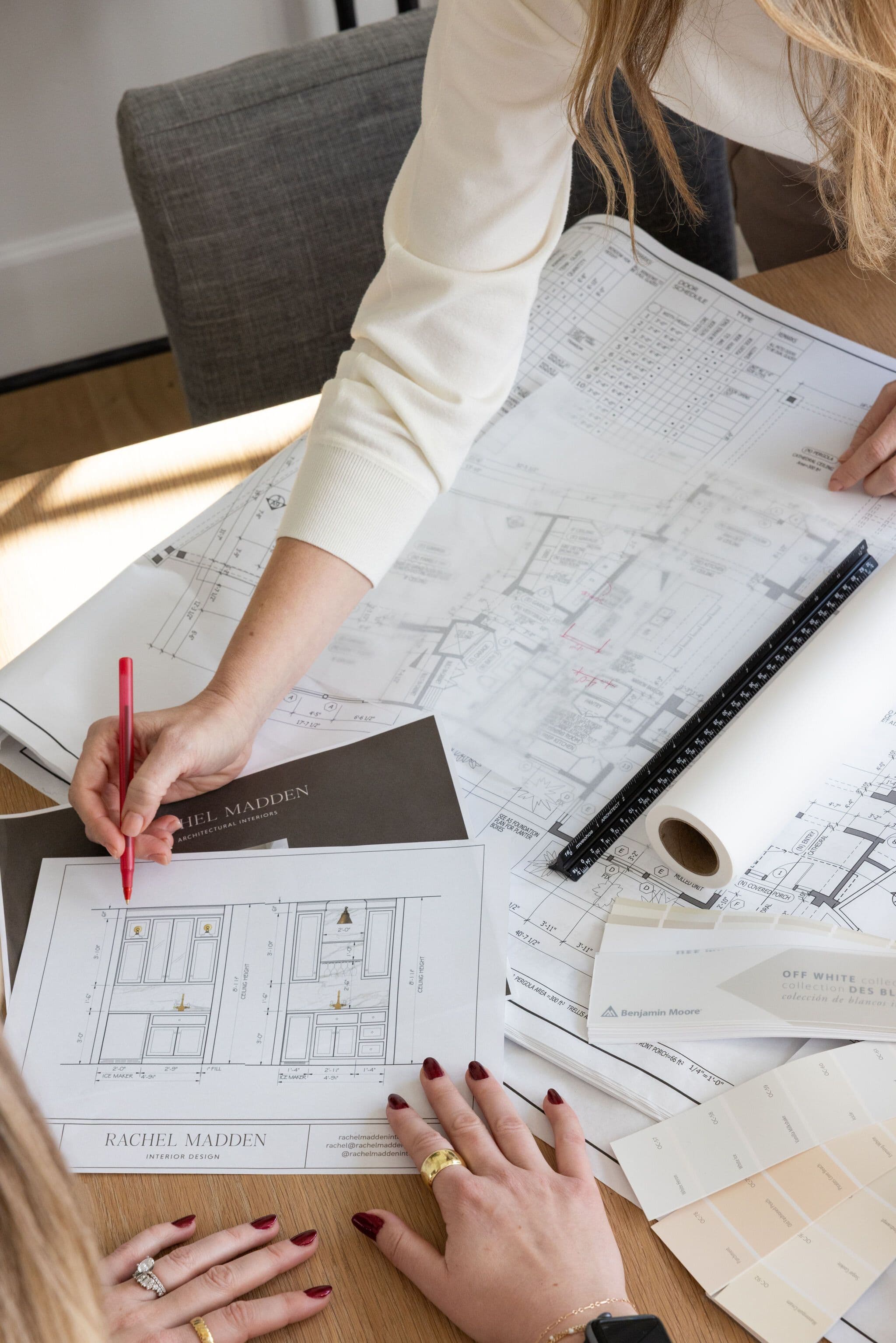 A photo of Rachel Madden drawing plans for a client's home
